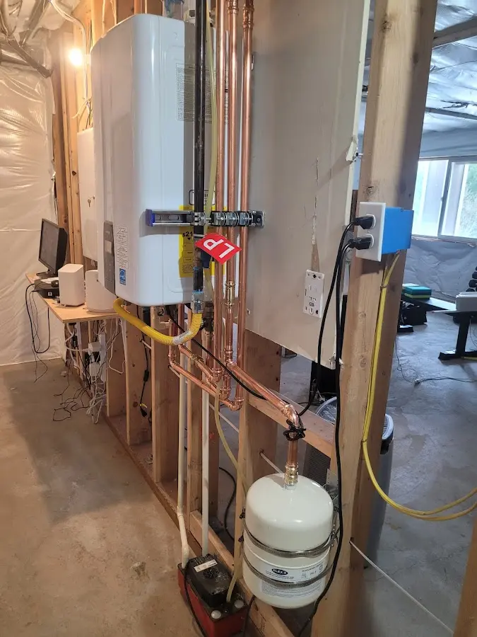 Licensed plumber repairing a kitchen sink in Bernalillo